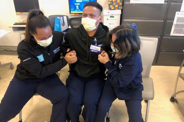 Three nurses at Resnick Neuropsychiatric Hospital participate in instructor Crisis Prevention & Intervention Training (CPI).