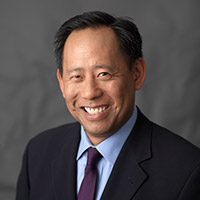 Executive Director, Dr. Mitchell D. Wong
