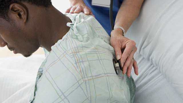 Man having examination in hospital.