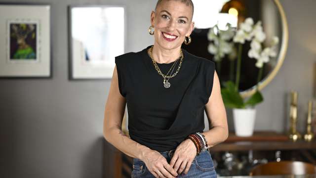 Ali Spuck smiles during a portrait session at her home