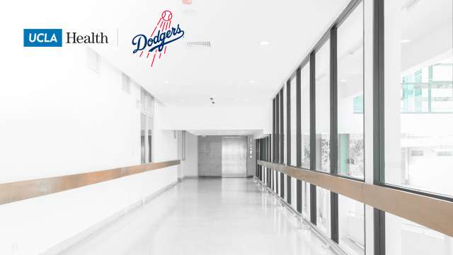 Zoom background of a hospital hallway with the UCLA Health Logo and dodgers Logo