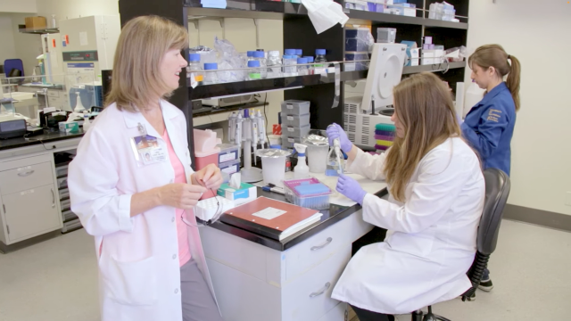 Dr. Demer and two physician scientists working in a lab.