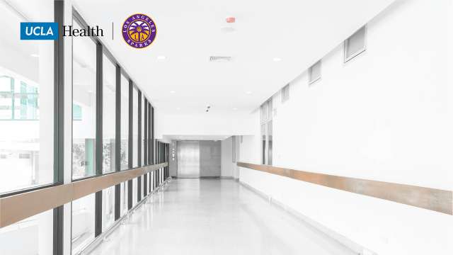 Zoom background of a hospital hallway with the UCLA Health Logo and sparks Logo