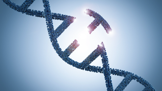 Broken DNA string with a light blue background and light shinning behind it.