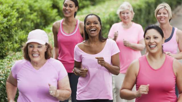 Breast cancer survivors running together outside