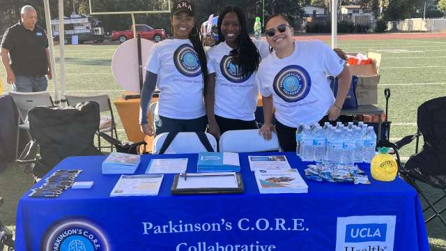 Three women behind health education booth