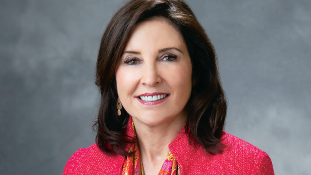 Headshot of Dr. Anne Coleman, MD - Chair & Executive Medical Director of the UCLA Department of Ophthalmology posing in front of a gray background.