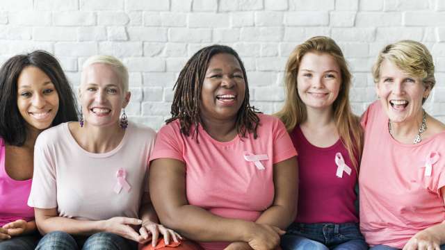 Breast cancer survivors sitting together
