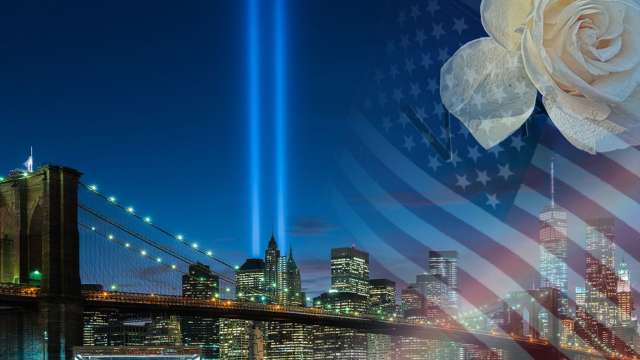 Brooklyn Bridge and Manhattan skyline with twin blue beams, American flag overlay and white rose