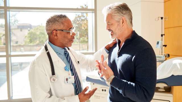 A doctor speaking with a patient