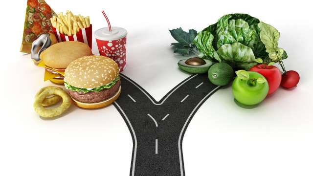Road with a choice between fast food and healthy food.