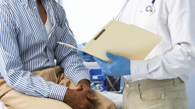 male doctor with male patient