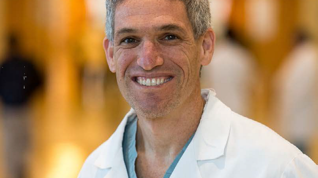 headshot of David A. Rigberg, MD taken in the hallway of a hospital