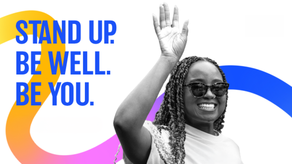 Female wearing dark glasses waving her hand - UCLA Pride Campaign