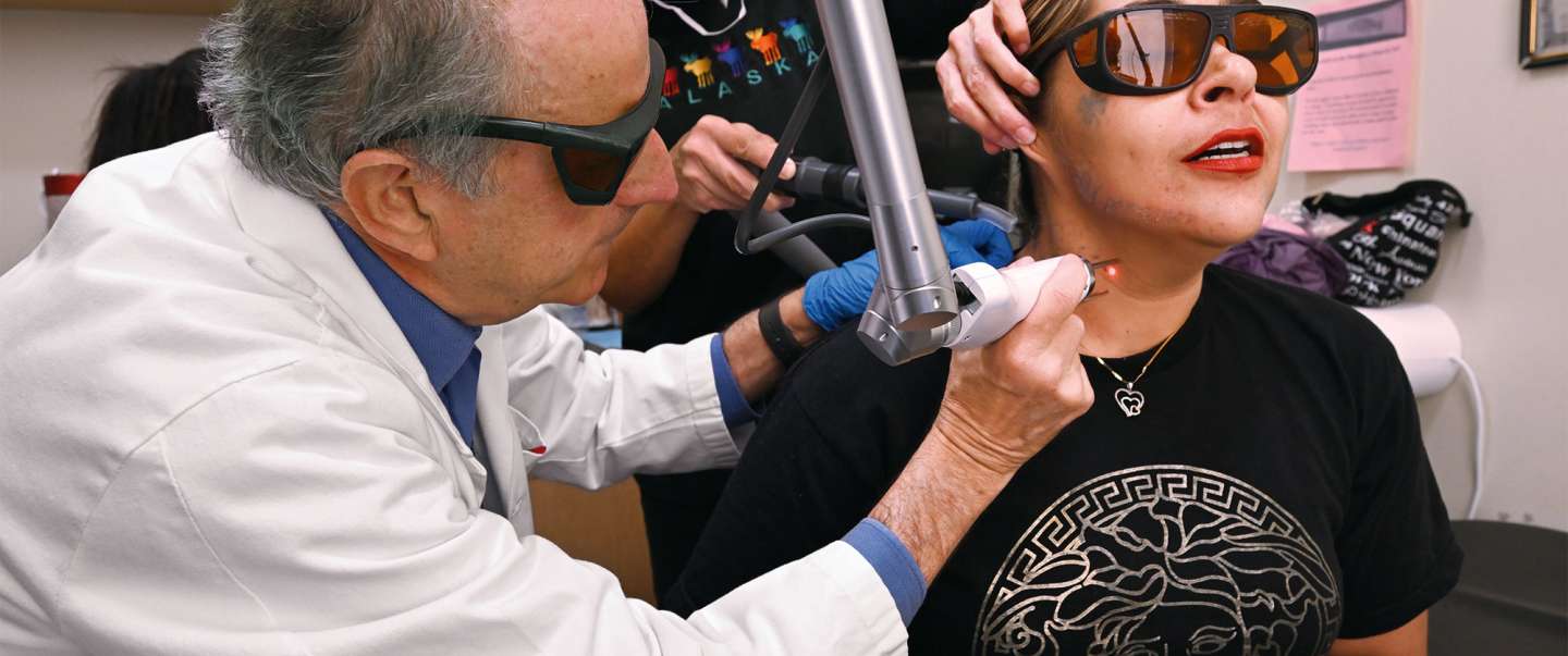 doctor removing tattoo with laser