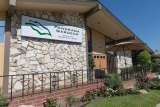 Panorama Gardens Nursing and Rehabilitation Center entrance with sign and flower beds.