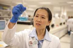 Doctor looks at sample