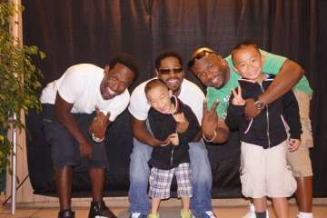 Sei Nagashima, center, with brother Kai, hang out with Boys II Men in 2012. The R&B vocalists have played an important role in the family's lives. (Photo courtesy of Taku Nagashima)