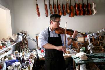 When he's not studying the brain, neursurgeon Dr. Daniel Lu is crafting world-class violins. (Photo by Anne Johansson)