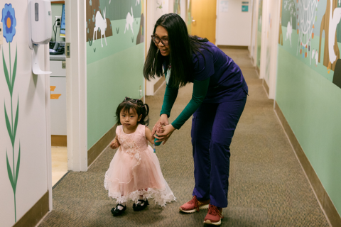 Child Life Specialist assists pediatric patient at UCLA Mattel Children's Hospital.