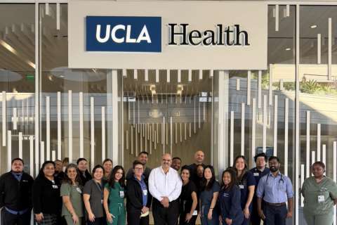 UCLA Health group of doctors and physicians and patient smiling together