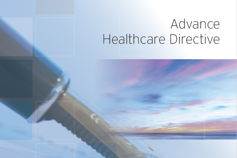 An fountain ink pen signing a paper with a sky in the background. Advance Healthcare Directive.