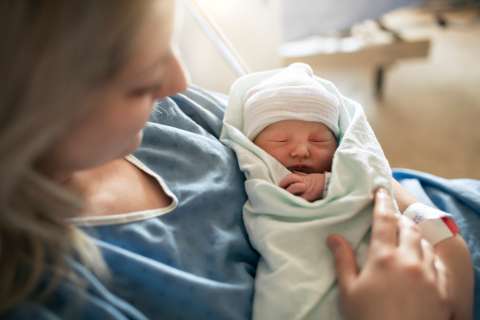 Mother holding newborn