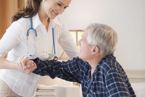 Nurse holding man's arm
