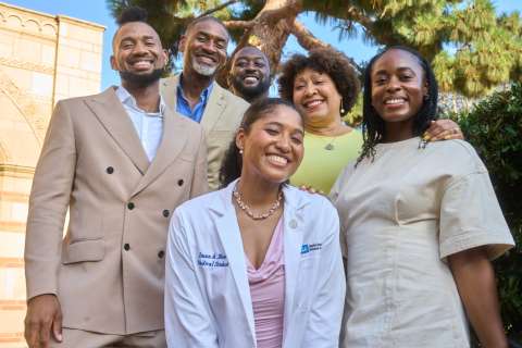 Medical student and her family pose for portrait.