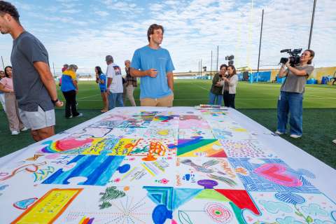 LA Chargers kicker Cameron Dicker with art therapy mosaic.