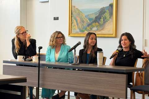 Panelists answer questions at a cancer survivors conference.