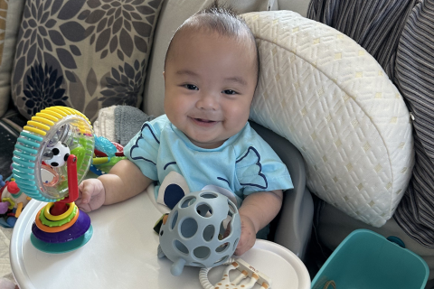 Francis Saputra in his high chair at home.