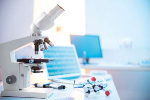 A microscope on a medical office desk