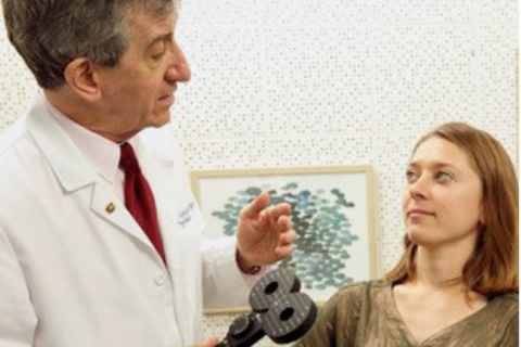 Dr. Andrew Leuchter speaks to a patient before TMS treatment.