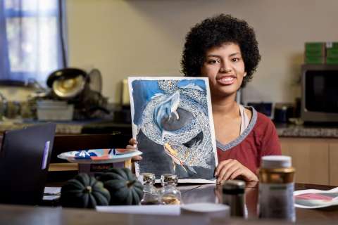 Jade Wilson shows her watercolor painting