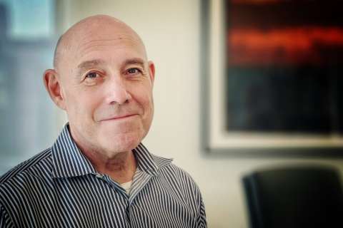 Photo of Dr. Mark S. Litwin in striped shirt in an office headshot.