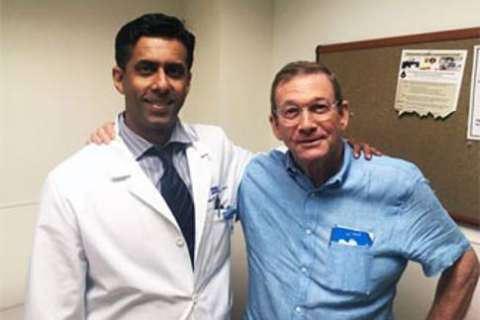 Doctor in white coat with prostatectomy patient at UCLA