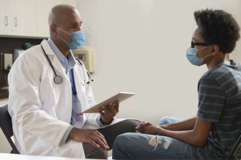 Doctor and patient discussing treatments or covid