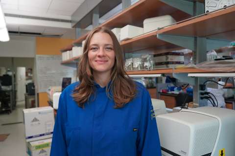 UCLA scientist Tara TeSlaa smiles in her lab.  
