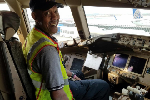 Herbert Williams in an airplane cockpit.