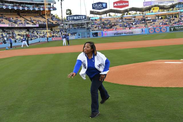 Angie Jones throws out the ceremonial first pitch before a preseason game between the Dodgers and Angels. (Photo by Jon SooHoo/©Los Angeles Dodgers, LLC 2023)