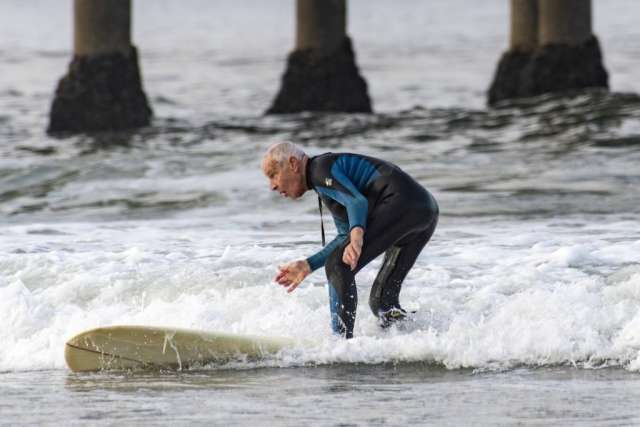 Robert Lombard catching a wave