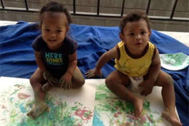 Dexter and Charlie, boys under going treatment, finger paint