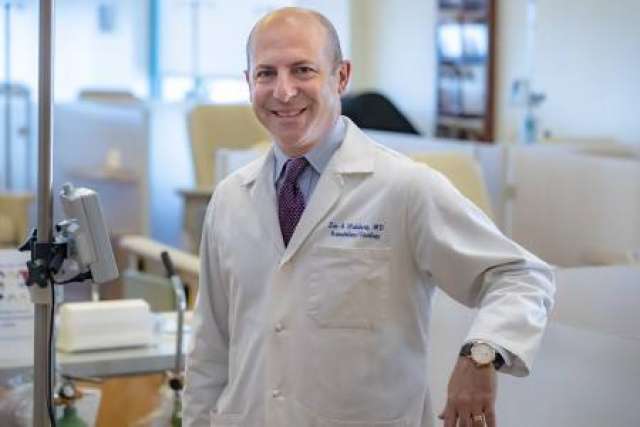 Dr. Zev Wainberg standing in a lab