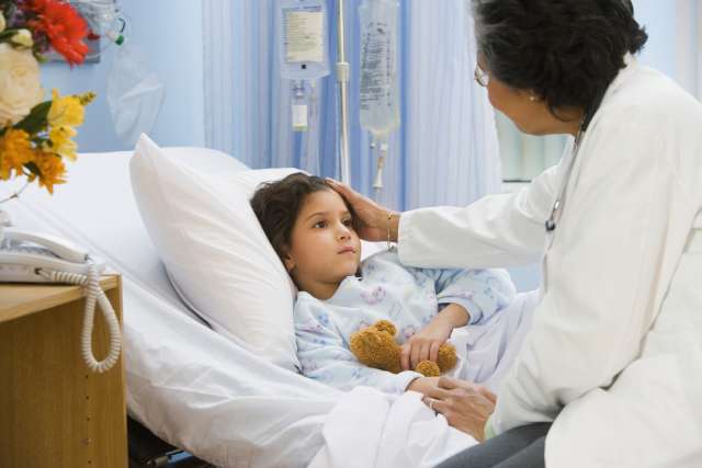 Girl in hospital bed