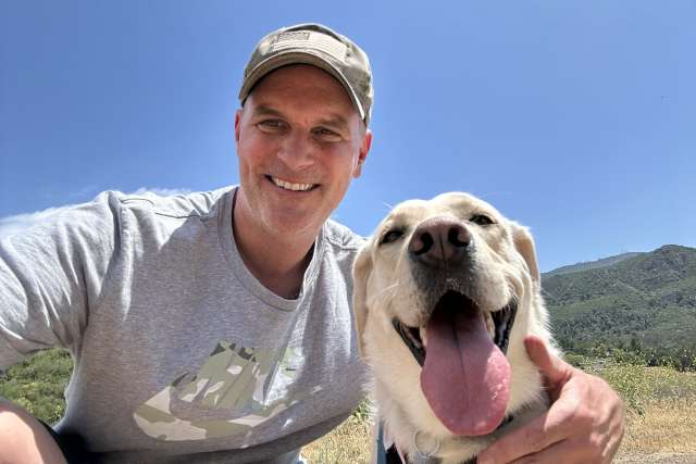 Man and dog on hiking trail