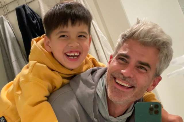 Jeffrey Allen smiles with his son Lucas, who has creatine transporter deficiency, highlighting their bond and rare‑disease gene‑therapy advocacy