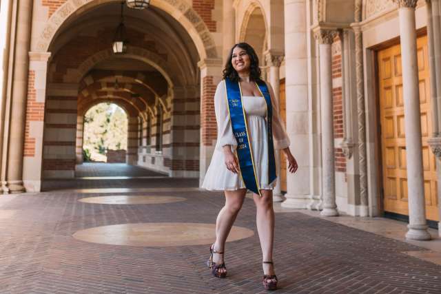 Neha Pai walks on campus on graduation day