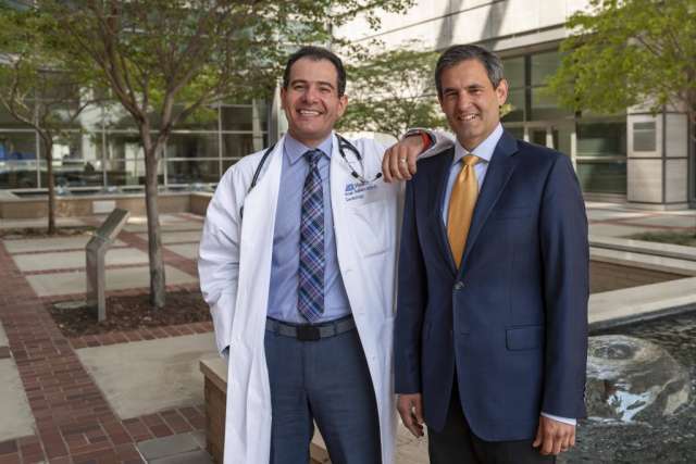  A professional headshot shows two men, Dr. Tamer (left) in a white coat and Dr. Sammy Saab (right) in a suit, standing side-by-side.