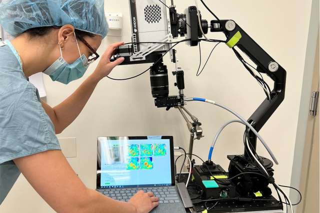 A UCLA Health resident operates a DOCI device in the lab.